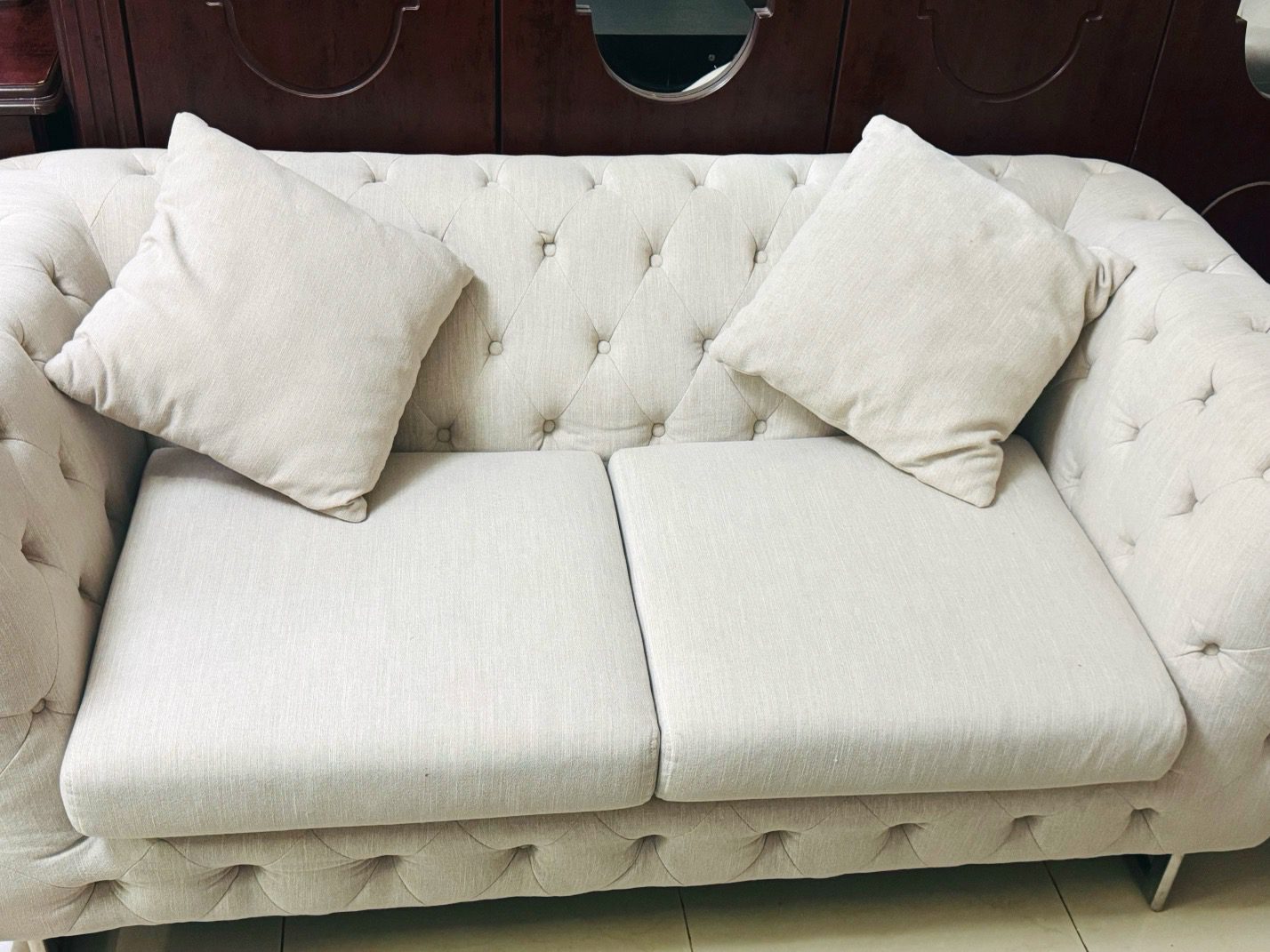 Elegant Beige Upholstered Sofa with Cushions
